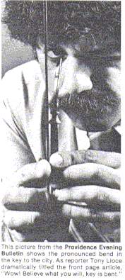 Reporter poses with key bent by Geller